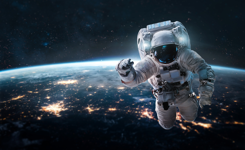Astronaut floating in space, isolated from Earth and the space station.