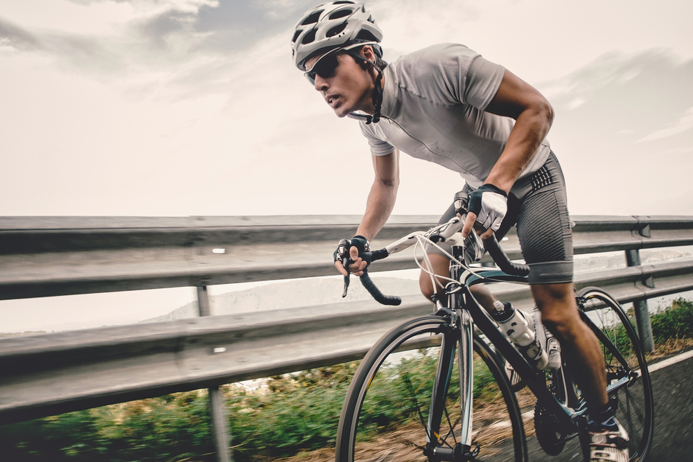A man on a bike.