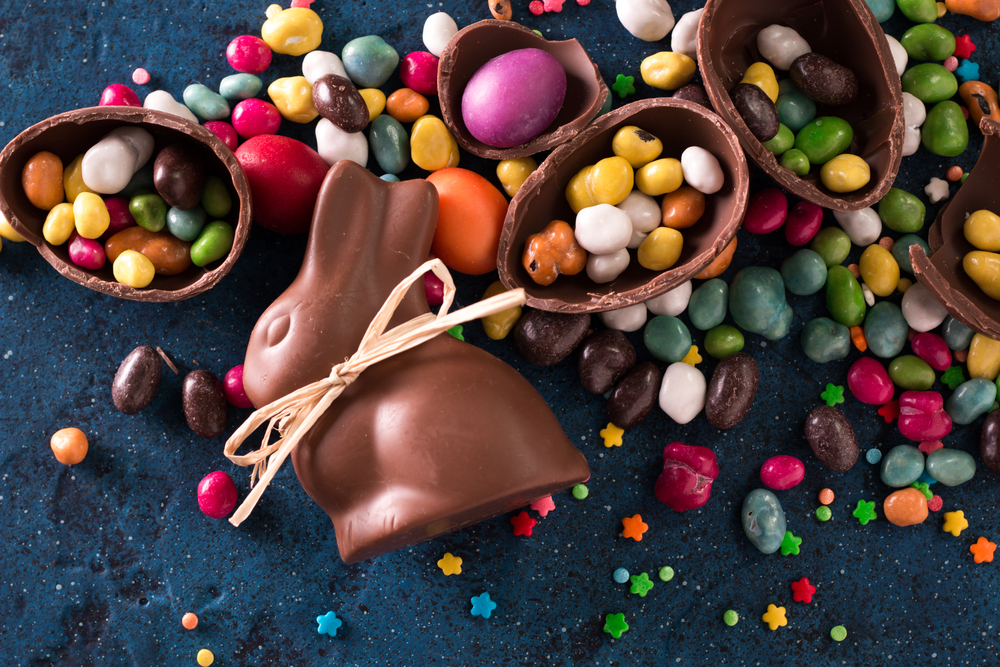 A chocolate Easter bunny, chocolate eggs, and jelly beans.