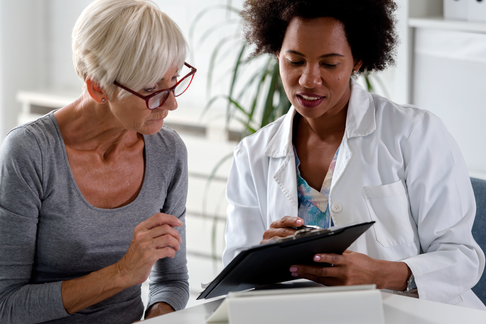 A doctor talks with a patient