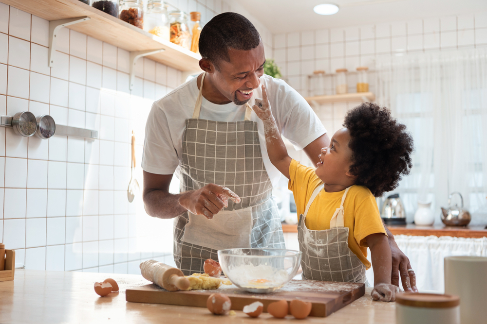 A father and son baking together.