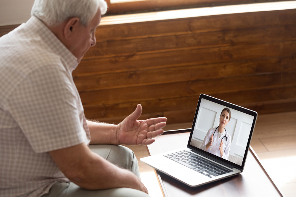 Man having a telehealth consultation.