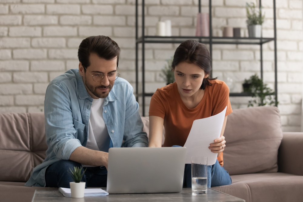 A couple looking at a laptop together