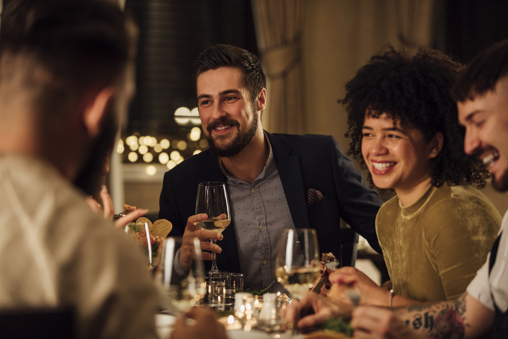 A group of friends enjoys dining at a restaurant.
