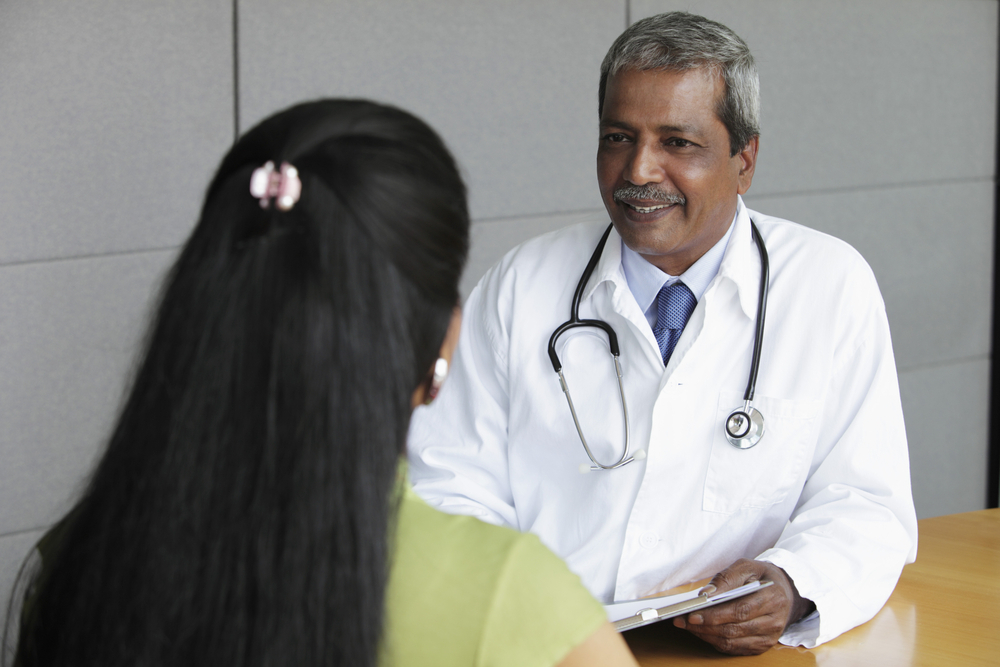 Woman meeting with her doctor.