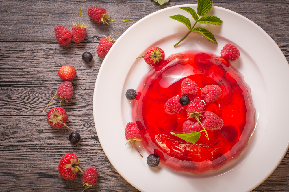 A red gelatin mold with berries.