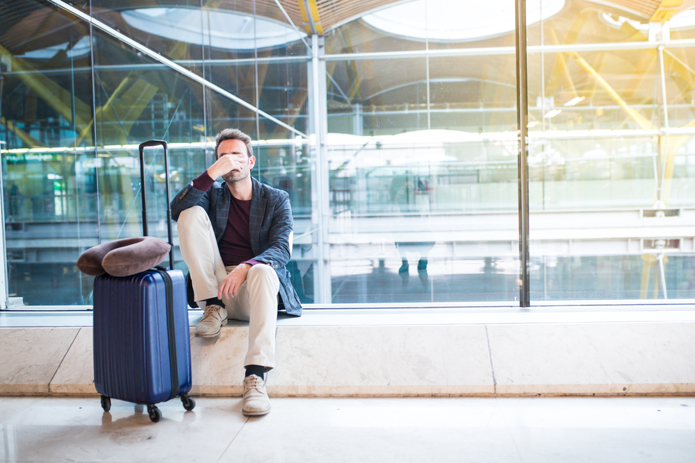 Tired man at an airport.
