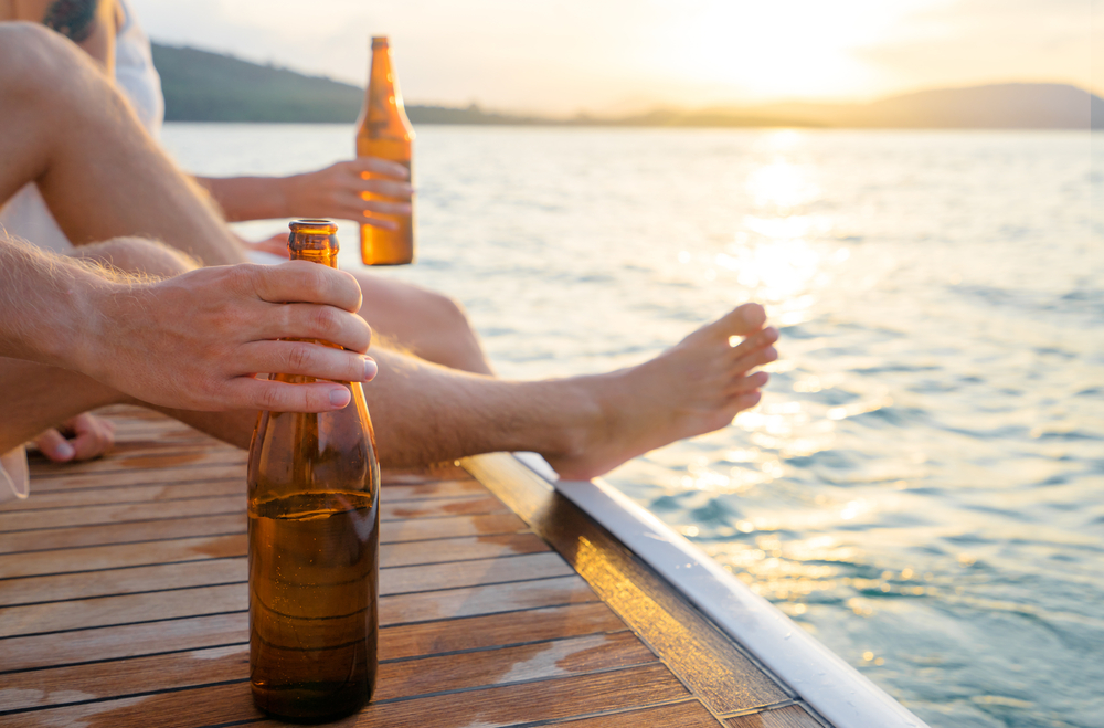 Individuals with type 1 diabetes enjoy beers by a lake.