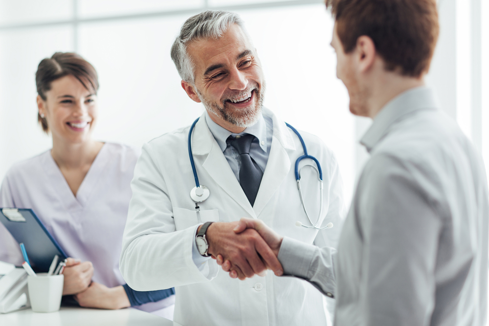 A patient with type 1 diabetes shakes his doctor's hand