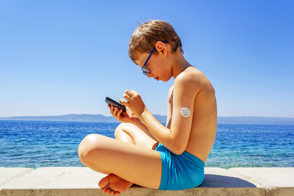 A boy looking at a CGM.