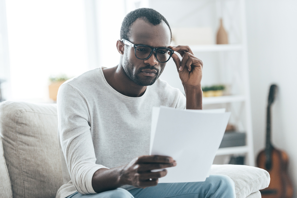 Man reading paperwork.