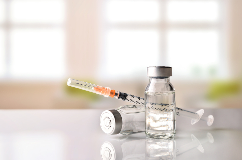 Insulin vials and other diabetes supplies sit on a countertop