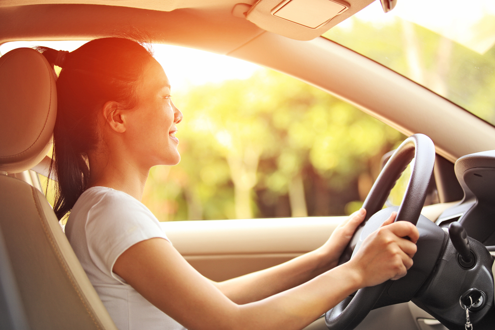 A woman driving a car