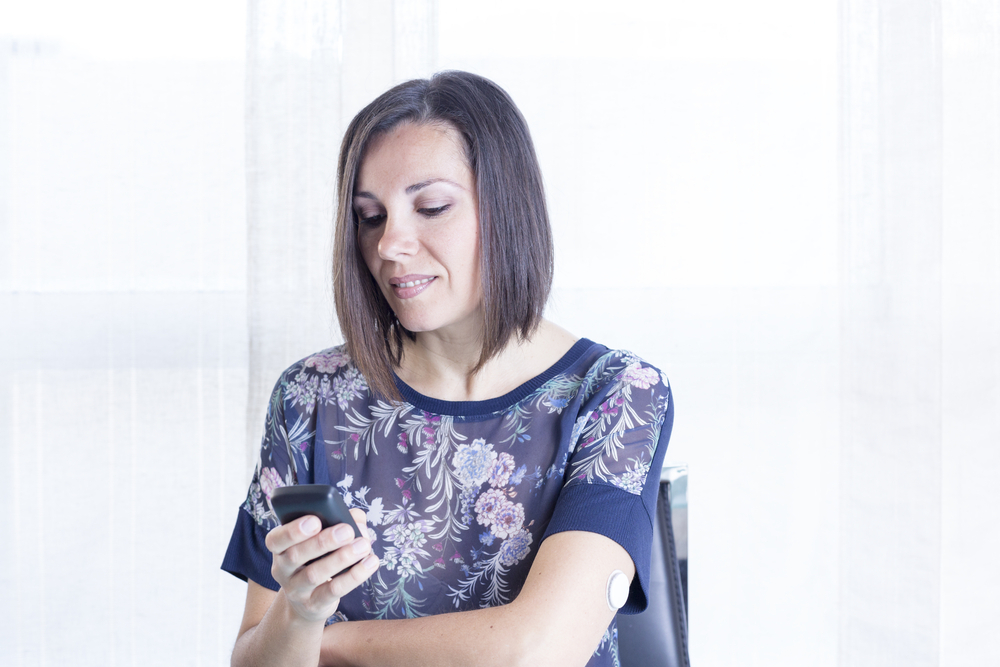 Woman using a CGM.