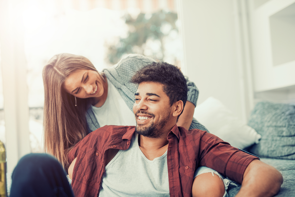 Smiling young couple with type 1 diabetes.