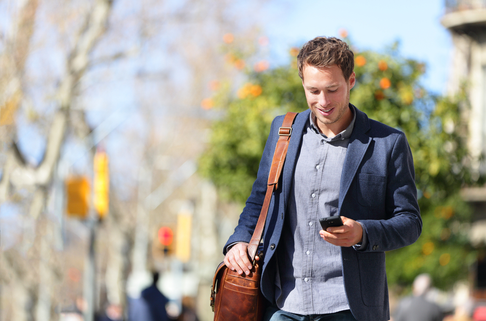 A man with diabetes connects with others through social media apps on his smartphone